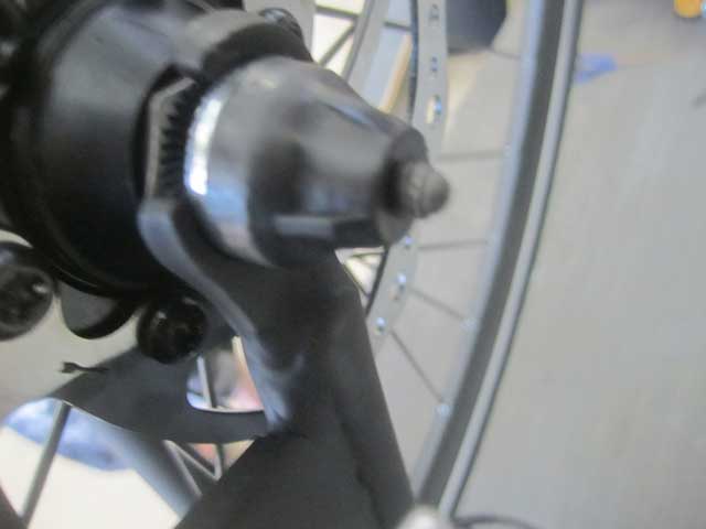 Tighten the locknut, until the quick release fully tightens the axle onto the fork. You want the quick release to close snugly, but you don’t want to overtighten it. You don’t want to have to “muscle” the quick release to close it, should close firmly, but without excessive force.