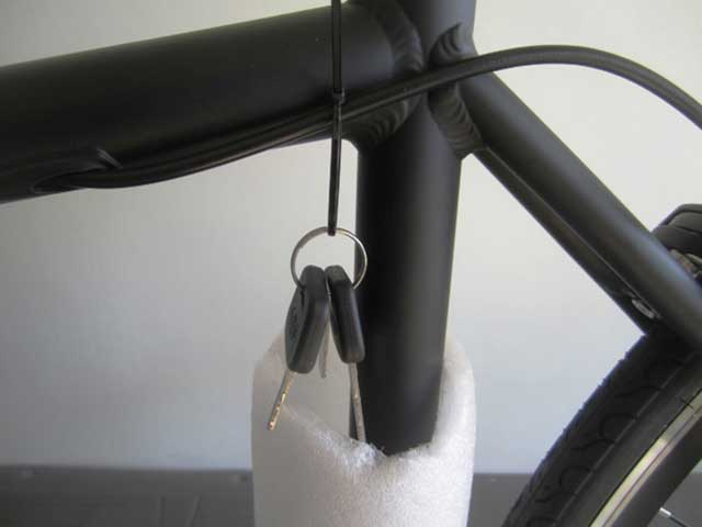 Remove battery lock keys and place in a safe place. You will need these keys if you want to remove the battery from the frame.