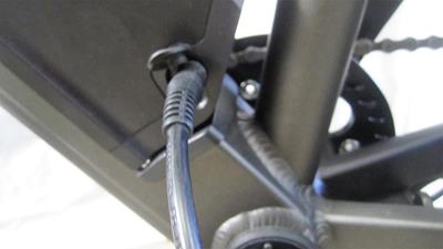 16. Plug the charger into the battery, then into the wall outlet. You can charge your battery on or off the bike. The charger will turn green when fully charged.