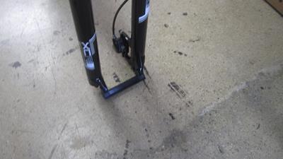 5. Remove fork spacer and front disc brake pad shipping spacer.