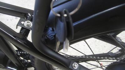 6. Remove battery lock keys and place in a safe place. You will need these keys if you want to remove the battery from the frame.