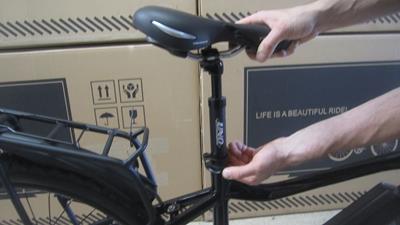 7. Place bike upright, resting on front fork, and insert seat post. Adjust and tighten seat quick release.